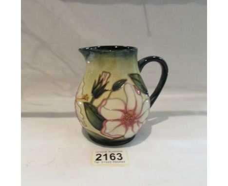 A 2002 limited edition signed Moorcroft jug, 65/250, approximately 4.5" tall.