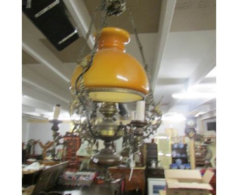 A 5 lamp hanging ceiling light with glass shade.