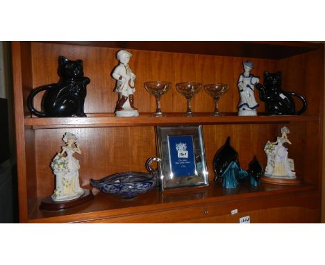 2 shelves of ornaments including 2 Poole pottery dolphins, 2 black cat teapots, a Murano swan bowl, 3 babycham glasses, 4 fig