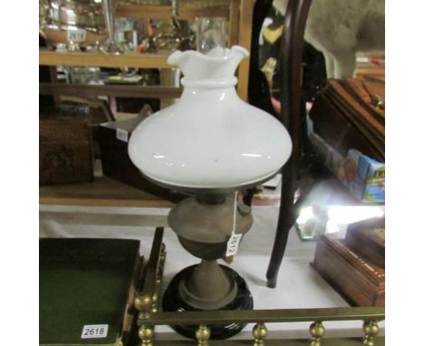 A brass oil lamp with shade,