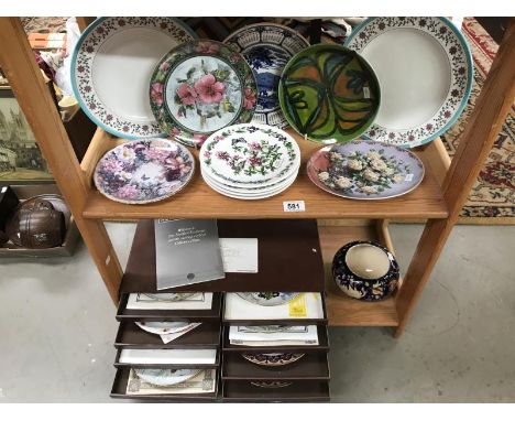 A collection of collectors plates, Poole pottery plate &amp; an 8 drawer collectors plate box