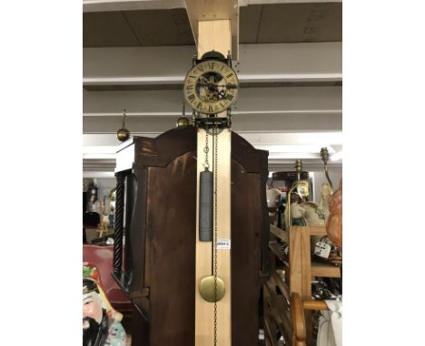 A Tempus fugit wall skeleton lantern clock