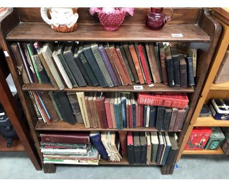 A dark wood 4 shelf bookcase