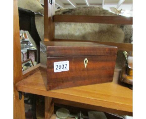A rosewood tea caddy.