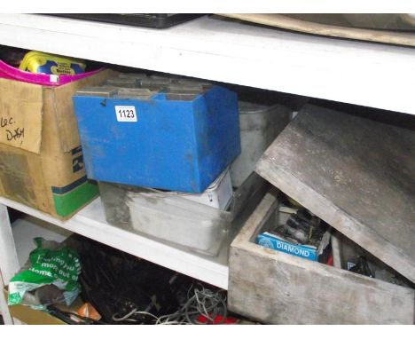 A shelf of various screws, nails, clamps, bolts etc.