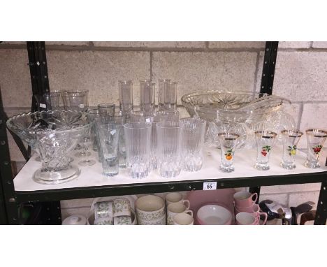 A shelf of good quality drinking glasses including punchbowl with 12 cups (only 8 hooks)