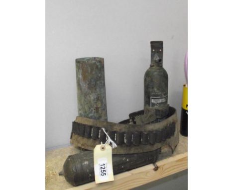 2 vintage fire extinguishers, shell case and a cartridge belt