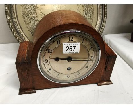 An oak mantel clock