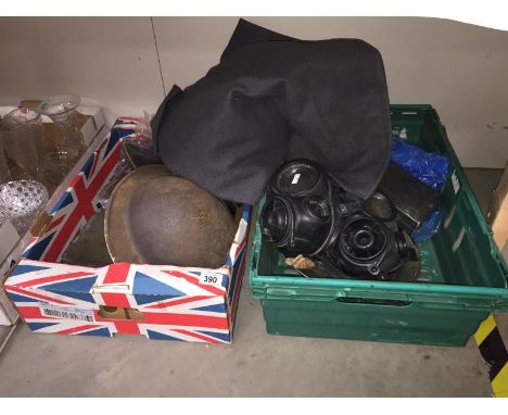 An assortment of military memorabilia including 2 Brodie helmets, gas mask, West German Air Force (Luftwaffe) peaked cap date