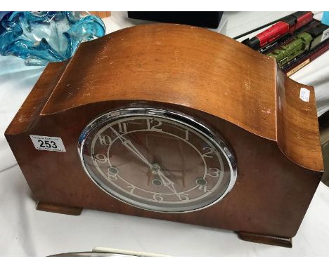 A Westminster chime mantel clock with key and pendulum