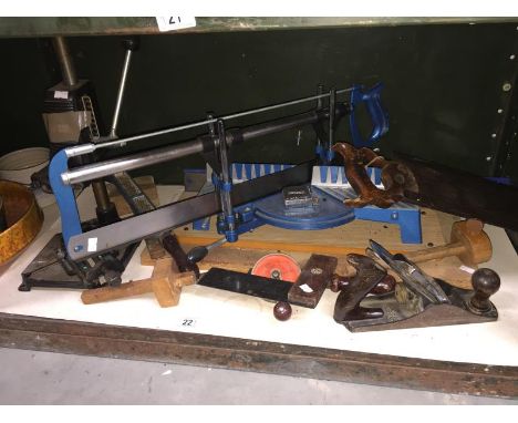 A shelf of woodworking tools including a Mitre saw with spare blades, a Black and Decker pillar drill accessory hand drill, p