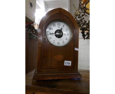 A Bulle battery operated mantel clock in mahogany inlaid case.