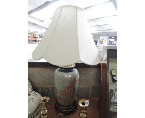 A vintage hand decorated table top lamp