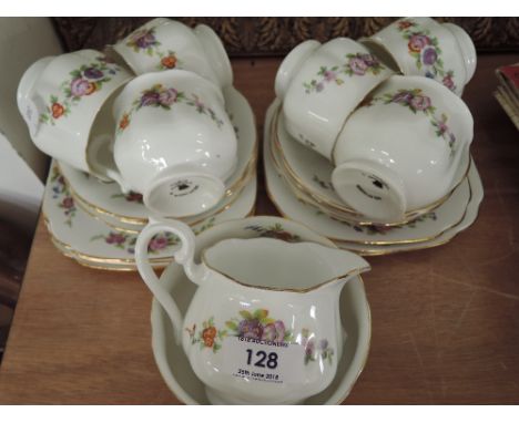 A vintage part tea service with enamel detailing
