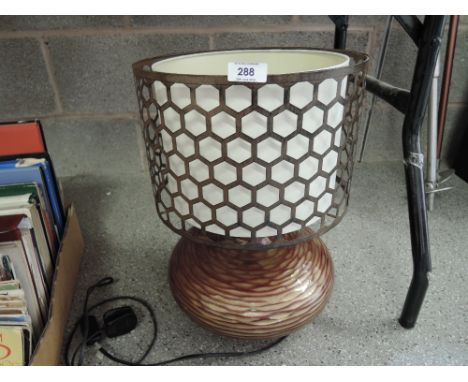 A modern style table lamp with rustic style shade