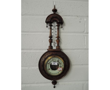 A carved frame barometer, thermometer 