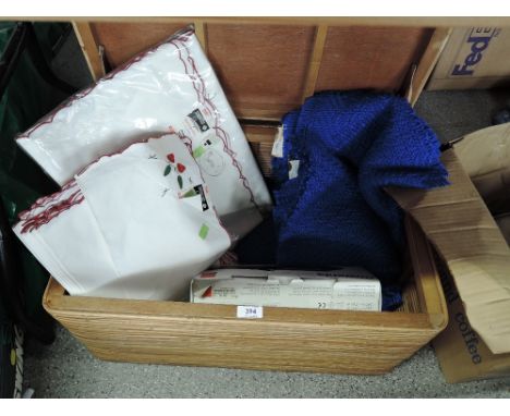 A vintage hamper containing Harrads napkins and Tablecloth  etc