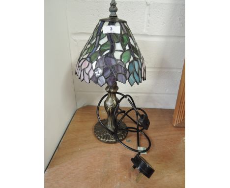 A Tiffany style table lamp and shade