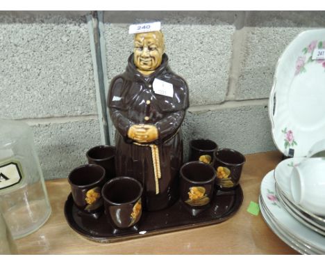 A vintage decanter and shot glass set in the form of monk