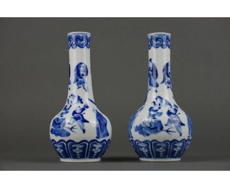 Two Chinese porcelain Blue and White vases with figures -Kangxi mark- 19th century Height: 21 cm Both in good condition. No c