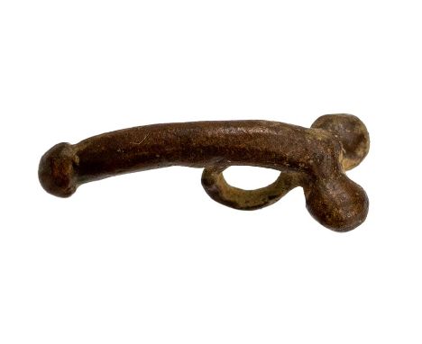 Roman, a complete copper-alloy phallic pendant or fascinus dating c. AD 43-410. The pendant takes the form of an erect, exagg