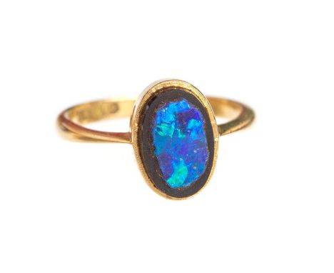 Early 20th Century Gold and Opel Ring. An antique 18ct gold ring set with a slice of black opal, size J, c. 2.5g. Hallmarks i