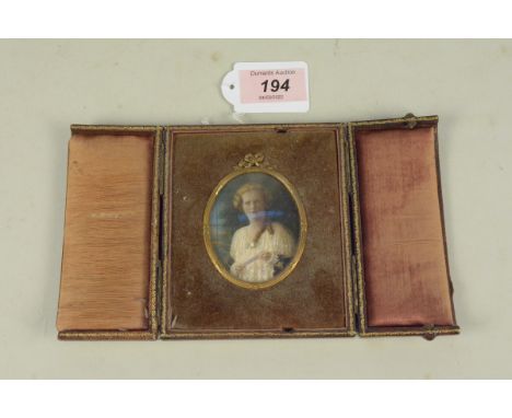A Victorian cased picture miniature with portrait of a lady in brown leather case, no obvious signature