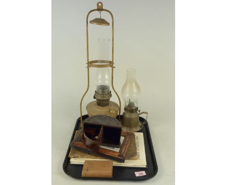 Two brass oil lamps, a Bakelite Art Deco cigarette box plus a vintage Great Yarmouth framed print and views booklet etc