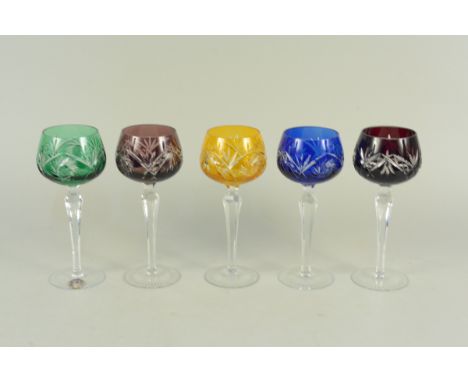 A part set of five vintage harlequin coloured cut to clear hock glasses, one bearing label Lausitzer Kristall Germany