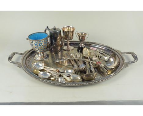 A plated oval two handled tray plus items of plated cutlery, large ladle, cups etc