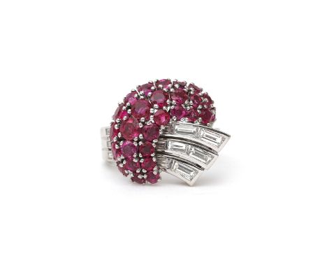 A platinum ruby and diamond retro ring, ca. 1950, Spritzer &amp; Fuhrmann. Featuring twenty eight rubies and eight baguette c