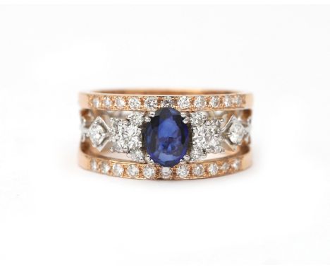 An 18 karat gold sapphire and diamond decachord ring. A wide ring of two rose gold bands amd a white gold mid part. Featuring