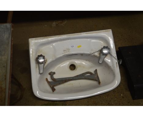 A white glazed ceramic sink 