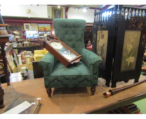 A Victorian walnut button back nursing chair, deep green upholstery, turned supports