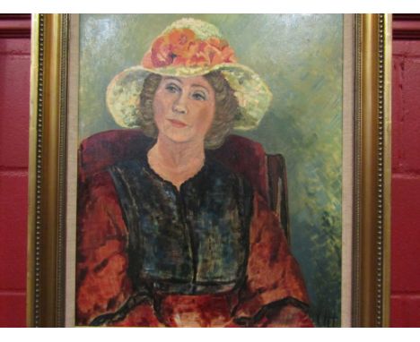An oil on canvas depicting a portrait of a seated lady wearing a hat, monogrammed lower right, framed, 58cm x 48cm