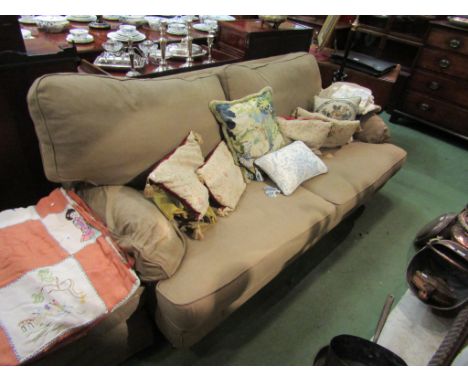 A taupe fabric three seater sofa