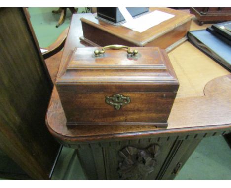 A George III mahogany tea caddy of sarcophagus form, with brass escutcheon and handle, the part-fitted interior retaining one