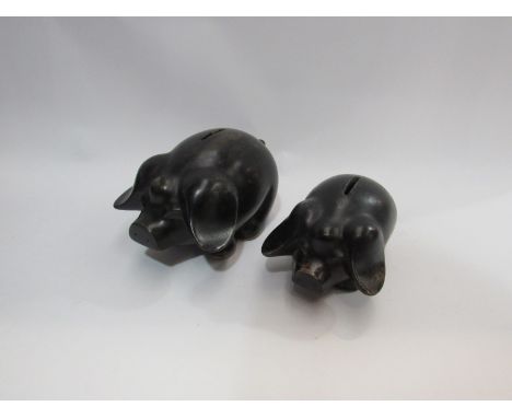 A near pair of ceramic piggy banks, smallest 15.5cm x 9cm. Larger 19cm x 12cm
