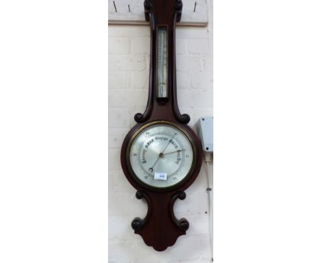 A late 19th century aneroid barometer with thermometer, in mahogany banjo shaped case