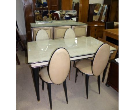 A retro 1960's dining suite in cream leather effect comprising rectangular table, 4 oval back chairs and sideboard of 3 cupbo