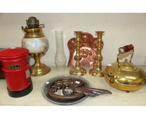  An oil lamp with ceramic reservoir; a brass kettle; candlesticks; etc.