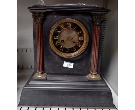 An architectural mantel clock in black marble with French movement