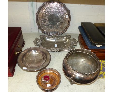 An Art Nouveau silver on brass dish decorated with female heads and flowers in relief; a silver plated wine coaster; a small 