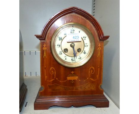 An Edwardian inlaid mahogany mantel clock with arch top, brass dial and French striking drum movement