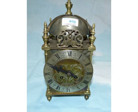 A Victorian brass lantern clock with French striking movement