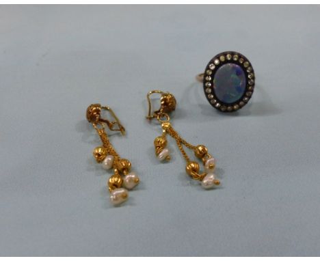 An opal set dress ring on yellow metal shank; a pair of earrings with freshwater pearl drops