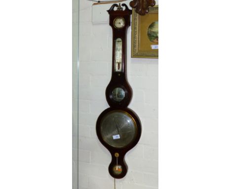 A 19th century mercury column barometer in mahogany banjo shaped case with boxwood and ebony line inlay, level, mirror, therm