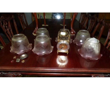 A reproduction lantern clock with later battery movement; a Victorian style set of 6 etched and folded cranberry shades