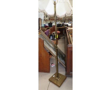 A brass standard lamp with square column; a modern Persian small prayer rug with red ground, length 57"