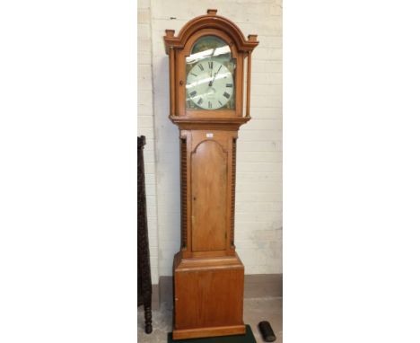 An early 19th century pine longcase clock with arched top and turned columns, quarter bobbin turned columns to the trunk, arc